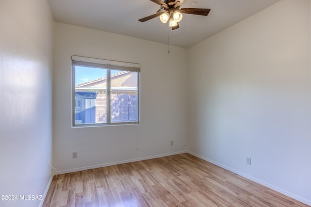 unfurnished room featuring ceiling fan and light wood-type flooring