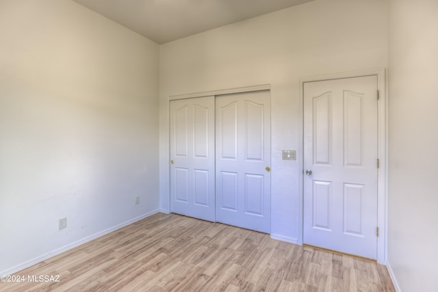 unfurnished bedroom with light wood-type flooring