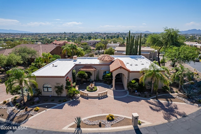 birds eye view of property with a mountain view