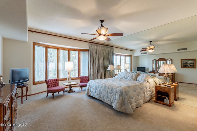 bedroom with ceiling fan and carpet flooring