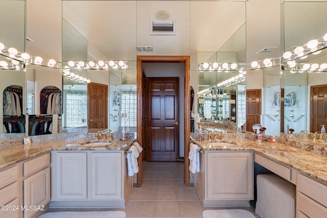 bathroom featuring tile patterned floors and vanity