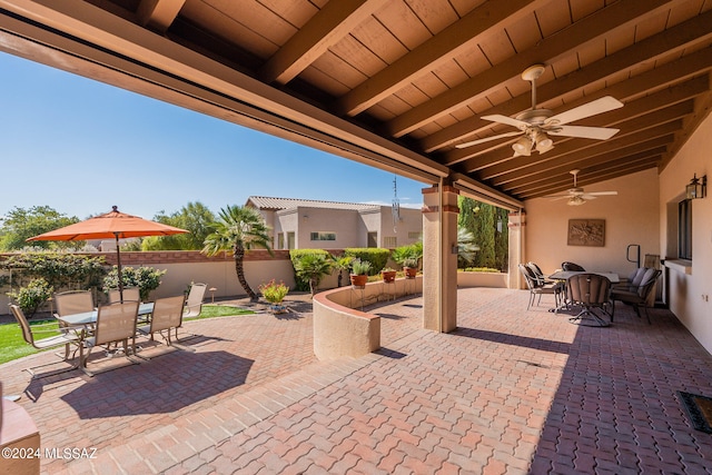 view of patio featuring ceiling fan