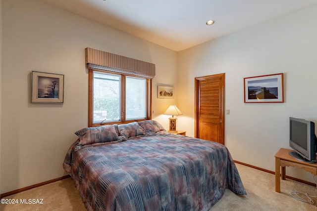 carpeted bedroom featuring a closet