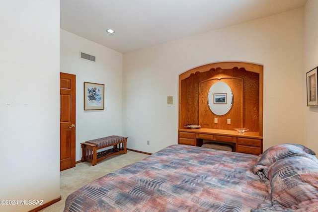 bedroom featuring light colored carpet