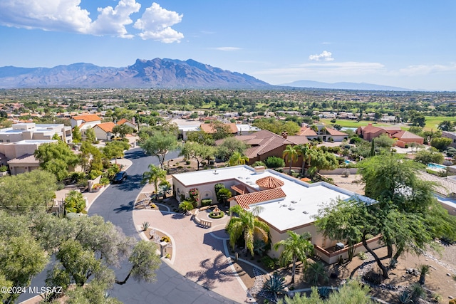 birds eye view of property with a mountain view