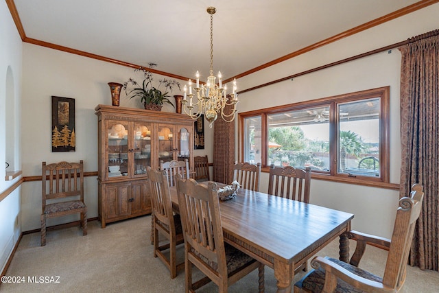 carpeted dining area with ornamental molding and a chandelier