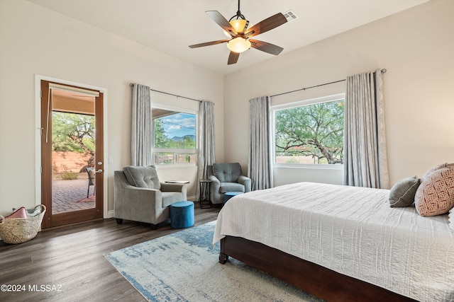 bedroom featuring dark wood-type flooring, access to outside, and ceiling fan