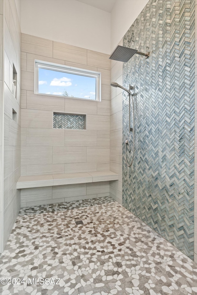 bathroom featuring tiled shower