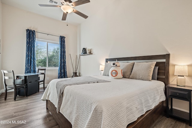 bedroom featuring wood-type flooring and ceiling fan