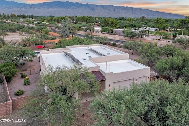 aerial view at dusk with a mountain view