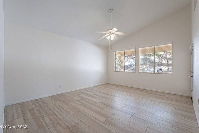 empty room featuring ceiling fan, light hardwood / wood-style floors, and high vaulted ceiling