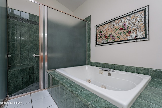 bathroom with separate shower and tub, tile patterned floors, and lofted ceiling