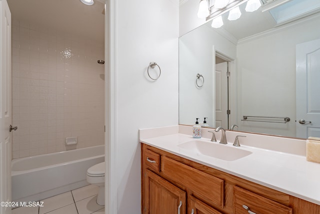 full bathroom featuring ornamental molding, vanity, tile patterned flooring, toilet, and tiled shower / bath