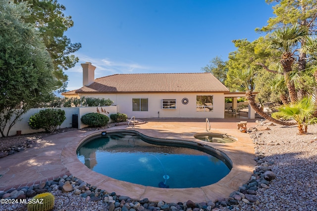 view of pool with a patio area and a jacuzzi