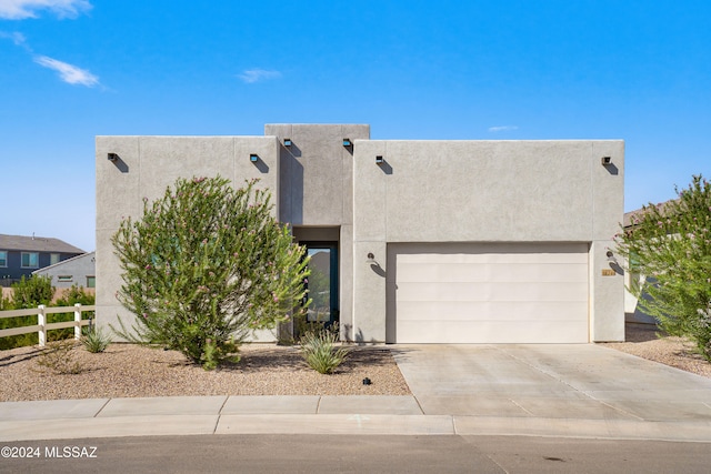 southwest-style home with a garage