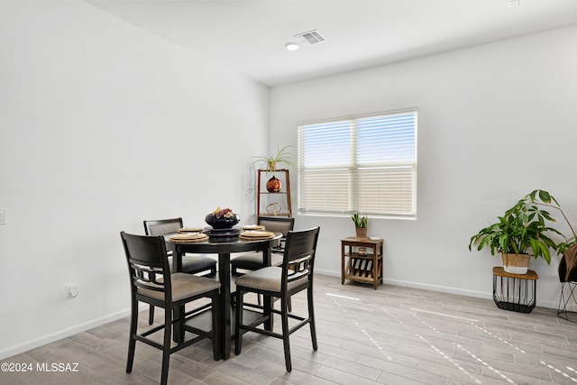 dining room with light wood-type flooring