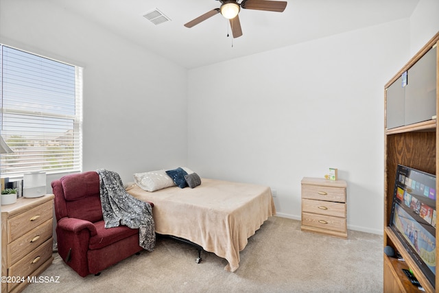 carpeted bedroom with ceiling fan