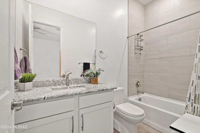 full bathroom featuring shower / tub combo, hardwood / wood-style floors, vanity, and toilet