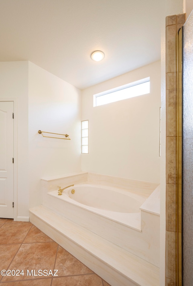 bathroom with plus walk in shower and tile patterned flooring