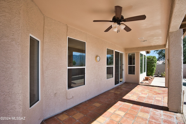 view of patio / terrace featuring ceiling fan