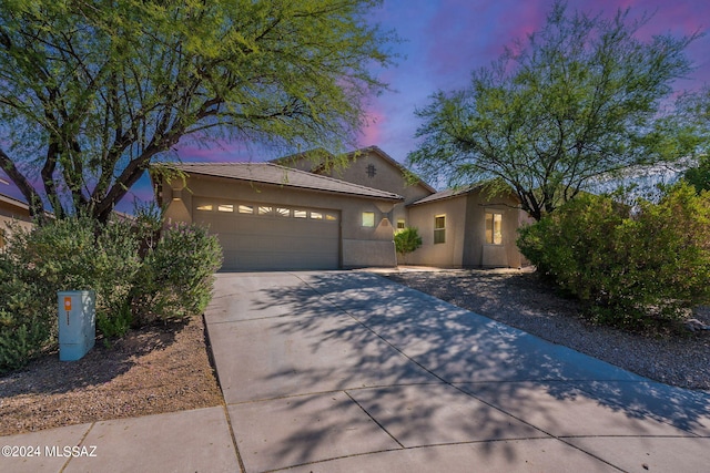 view of front of home with a garage