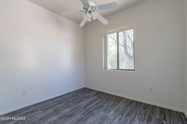 unfurnished room with ceiling fan and dark hardwood / wood-style flooring