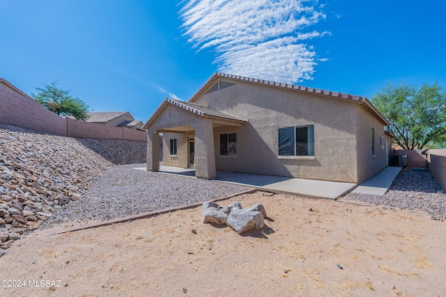 rear view of house with a patio