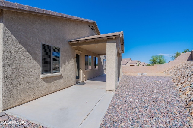 rear view of property with a patio area