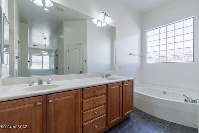 bathroom with vanity, shower with separate bathtub, and tile patterned floors