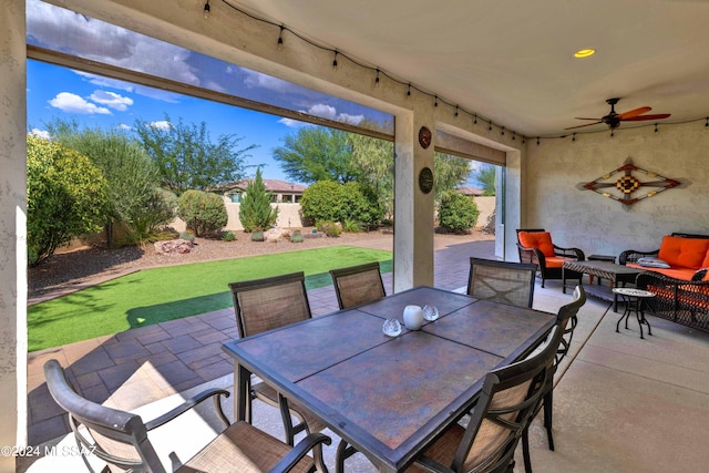 view of patio with outdoor lounge area and ceiling fan