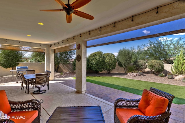 view of patio featuring grilling area and ceiling fan