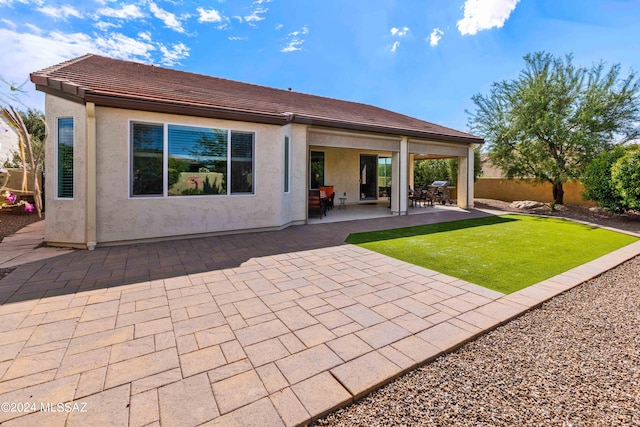 back of house featuring a patio area