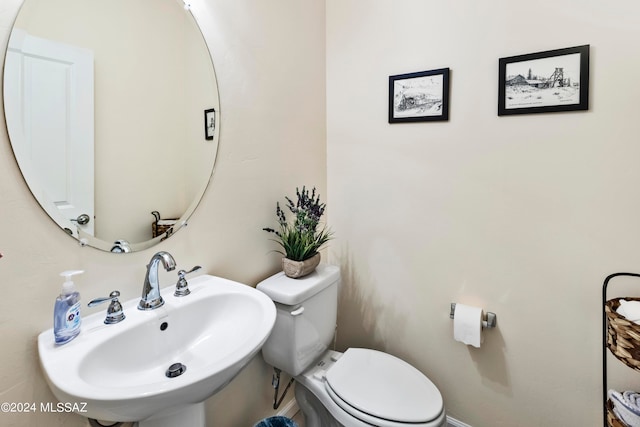 bathroom with sink and toilet