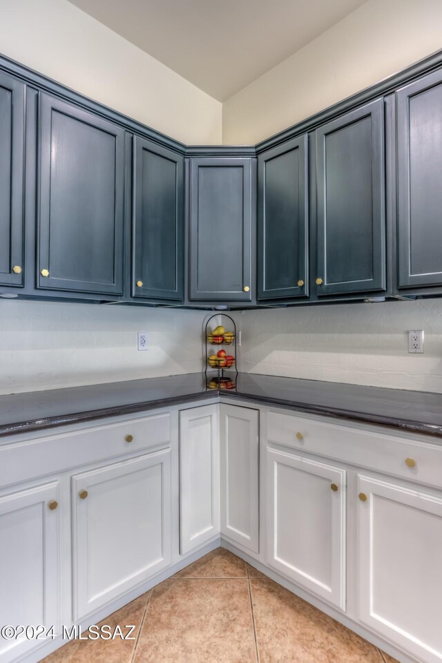 laundry area featuring light tile patterned flooring