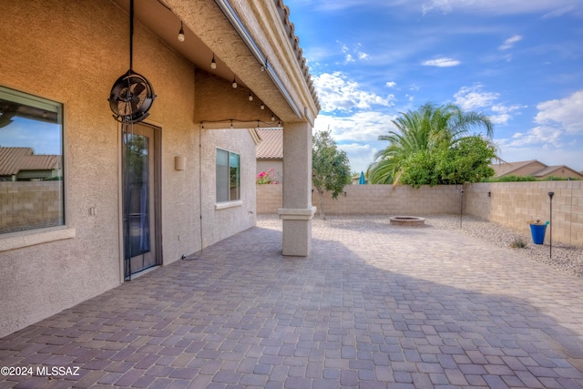 view of patio / terrace with a fire pit