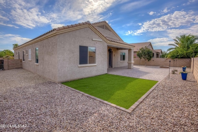 back of property with a patio area