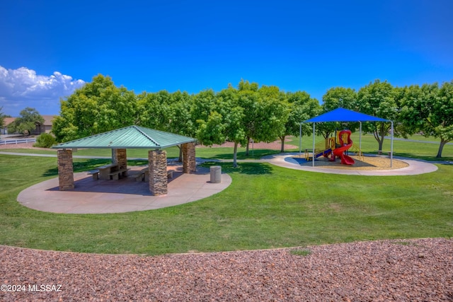 surrounding community with a yard and a playground