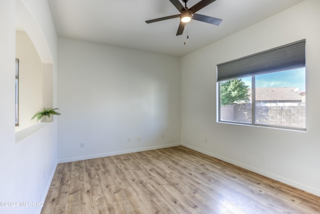 unfurnished room with ceiling fan and light hardwood / wood-style floors