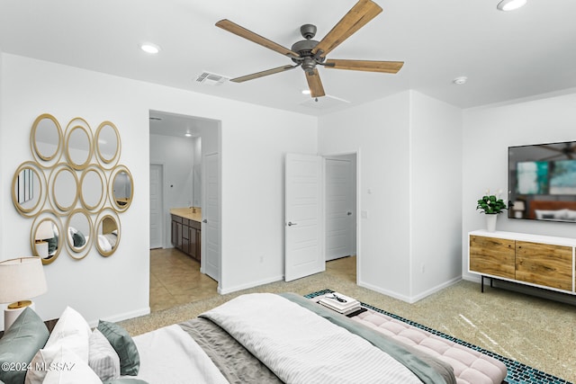 carpeted bedroom with ceiling fan and connected bathroom