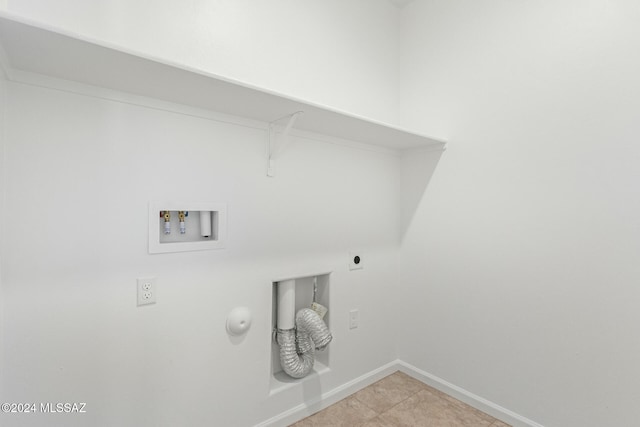 laundry area with hookup for a washing machine, hookup for an electric dryer, and light tile patterned floors