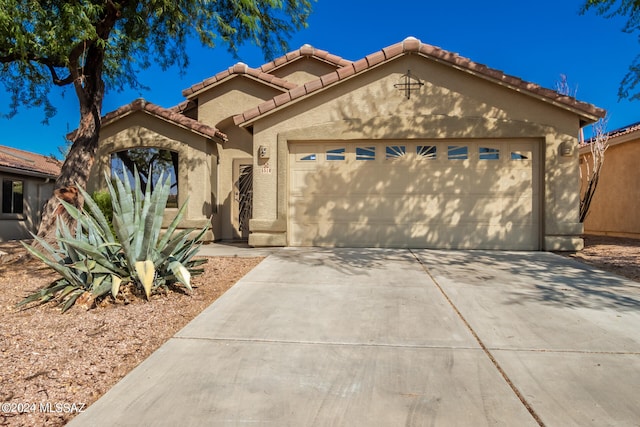 view of front of property featuring a garage