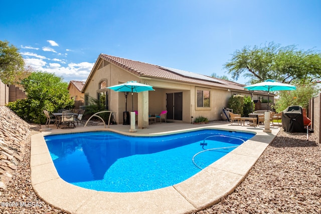 view of swimming pool with a patio