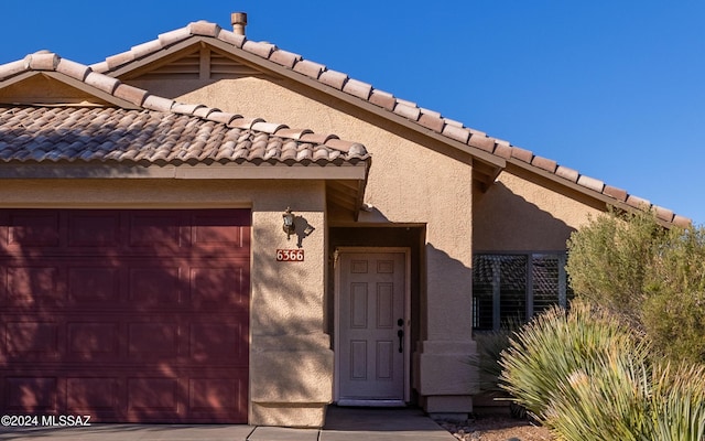 entrance to property with a garage