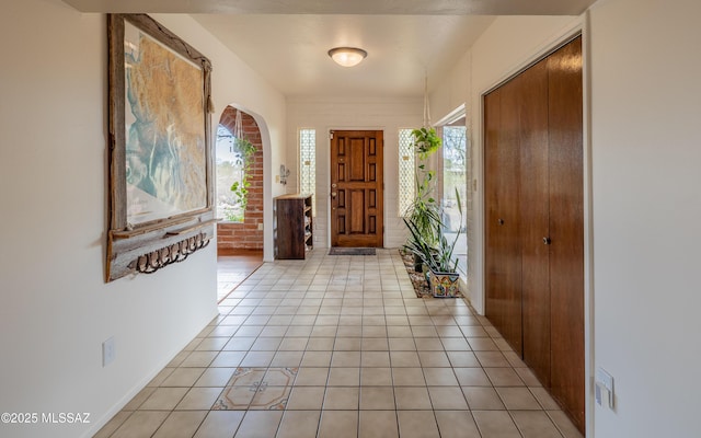 entryway with light tile patterned flooring