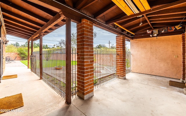 view of patio featuring fence