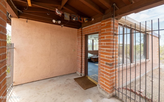 view of exterior entry featuring brick siding