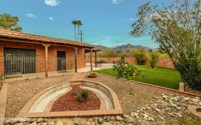 view of yard featuring fence and a patio area