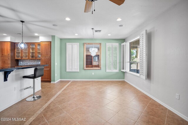interior space with recessed lighting, ceiling fan, visible vents, and light tile patterned floors