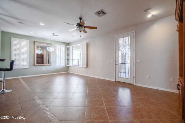 interior space with ceiling fan, tile patterned floors, recessed lighting, baseboards, and visible vents