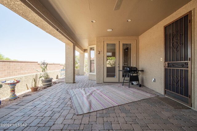 view of patio featuring fence and area for grilling